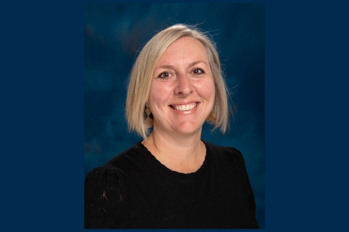 Portrait of blonde woman in dark sweater